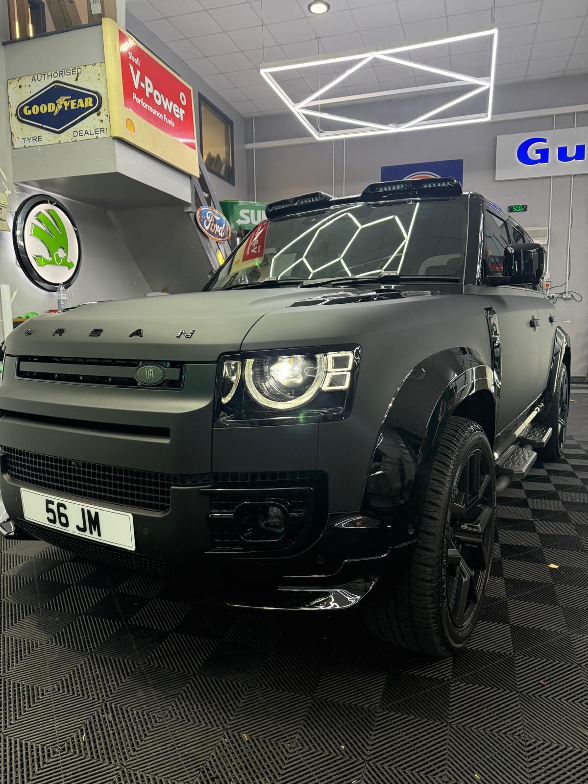 Land Rover Defender with full matte black wrap in the ATZ Group studio